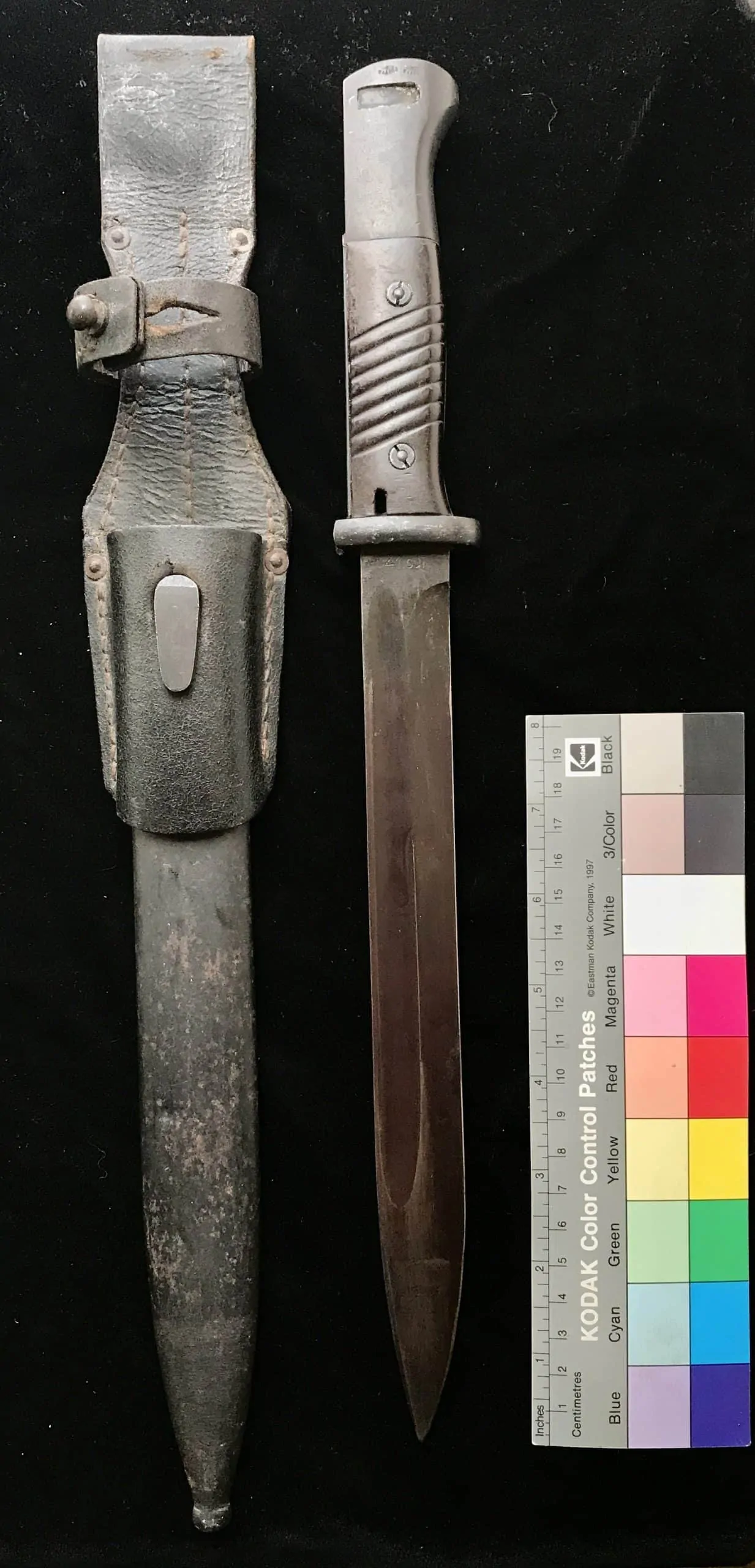 Original WWII German K98 combat bayonet with leather frog, full view