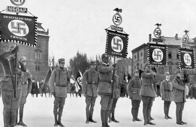 WWII-era Nazi flag displayed with U.S. military memorabilia from the war