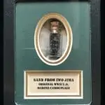 A Vial Of Black Sand From Iwo Jima Plus WWII Marine Camo In Collector's Glass Case