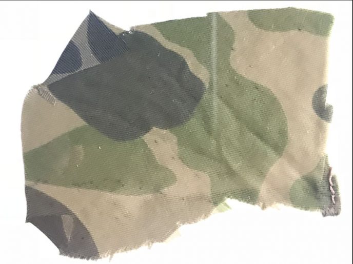 Authentic piece of U.S. parachute used on D-Day by a 101st Airborne paratrooper in display case