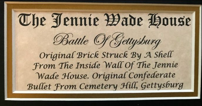 Collector’s display featuring Jennie Wade House brick and a Confederate bullet from Gettysburg