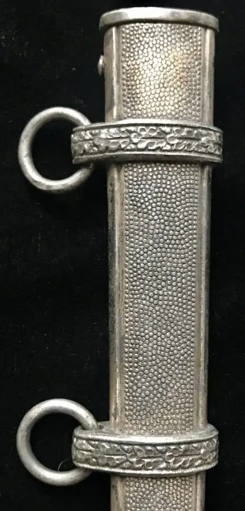 Detailed view of the dagger's intricate design on the sheath