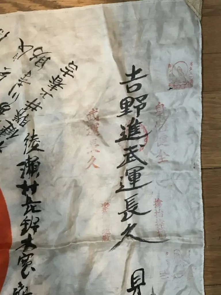 Close-up of a WWII Japanese soldier’s personal flag, featuring kanji messages, on display at the Gettysburg Museum