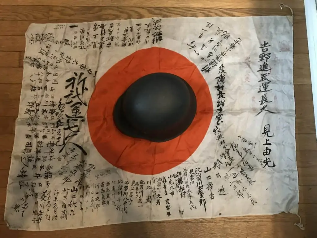 Personal WWII Japanese national flag with kanji writing, brought home by a U.S. veteran