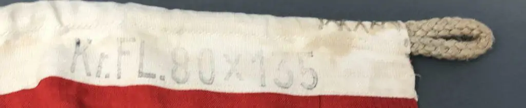 Detailed view of the WWII Nazi war flag’s construction and stitching, brought home by a U.S. veteran