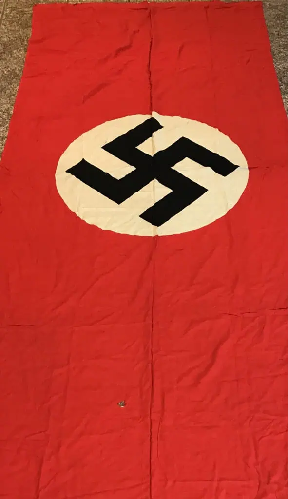 Large WWII-era German SS-marked Nazi Party flag displayed vertically, certified by Gettysburg Museum of History